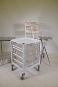 A stainless steel two tier medical instrument table, a fold up instrument table and two medical