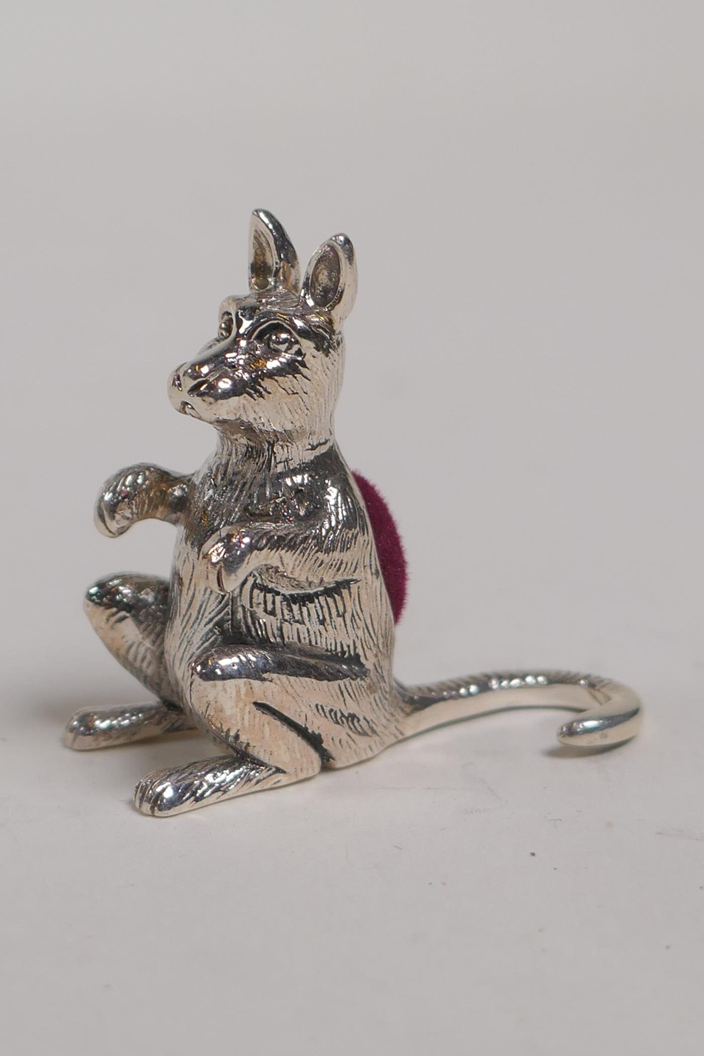 A sterling silver miniature pincushion in the form of a kangaroo, 1" high