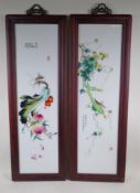A pair of Chinese polychrome porcelain panels decorated with insects amongst fruiting vines and