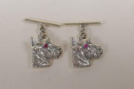 A pair of sterling silver dogs head cufflinks