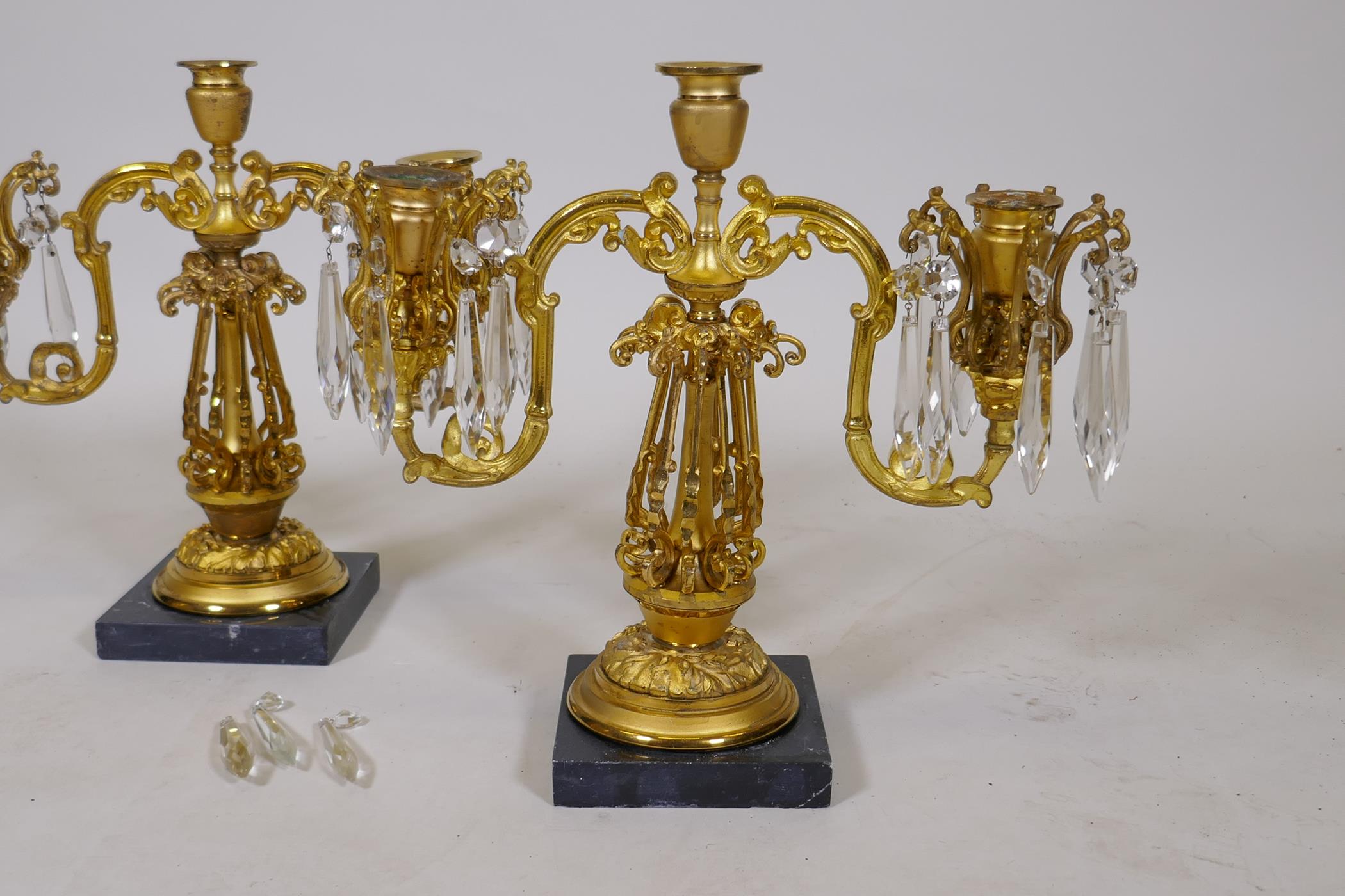 A pair of C19th two branch candelabra with pierced columns and lustre drops, lacking three, 13" high - Image 2 of 3