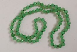 A string of small jade beads, 26" long