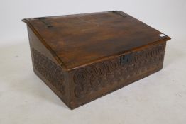 An C18th oak bible box with carved front and side panels, 29" x 14", 19" high