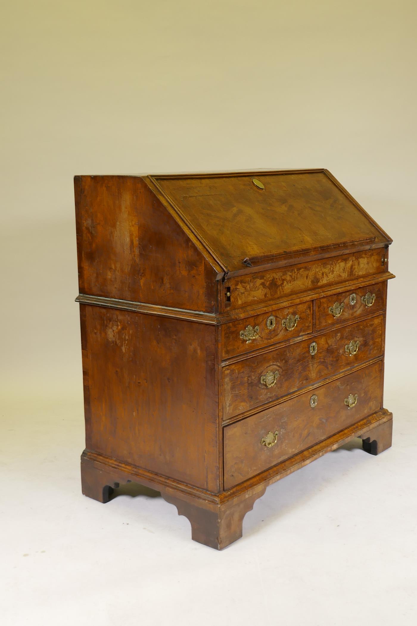 An C18th feather banded and figured walnut fall front bureau, the stepped interior with concave - Image 7 of 10