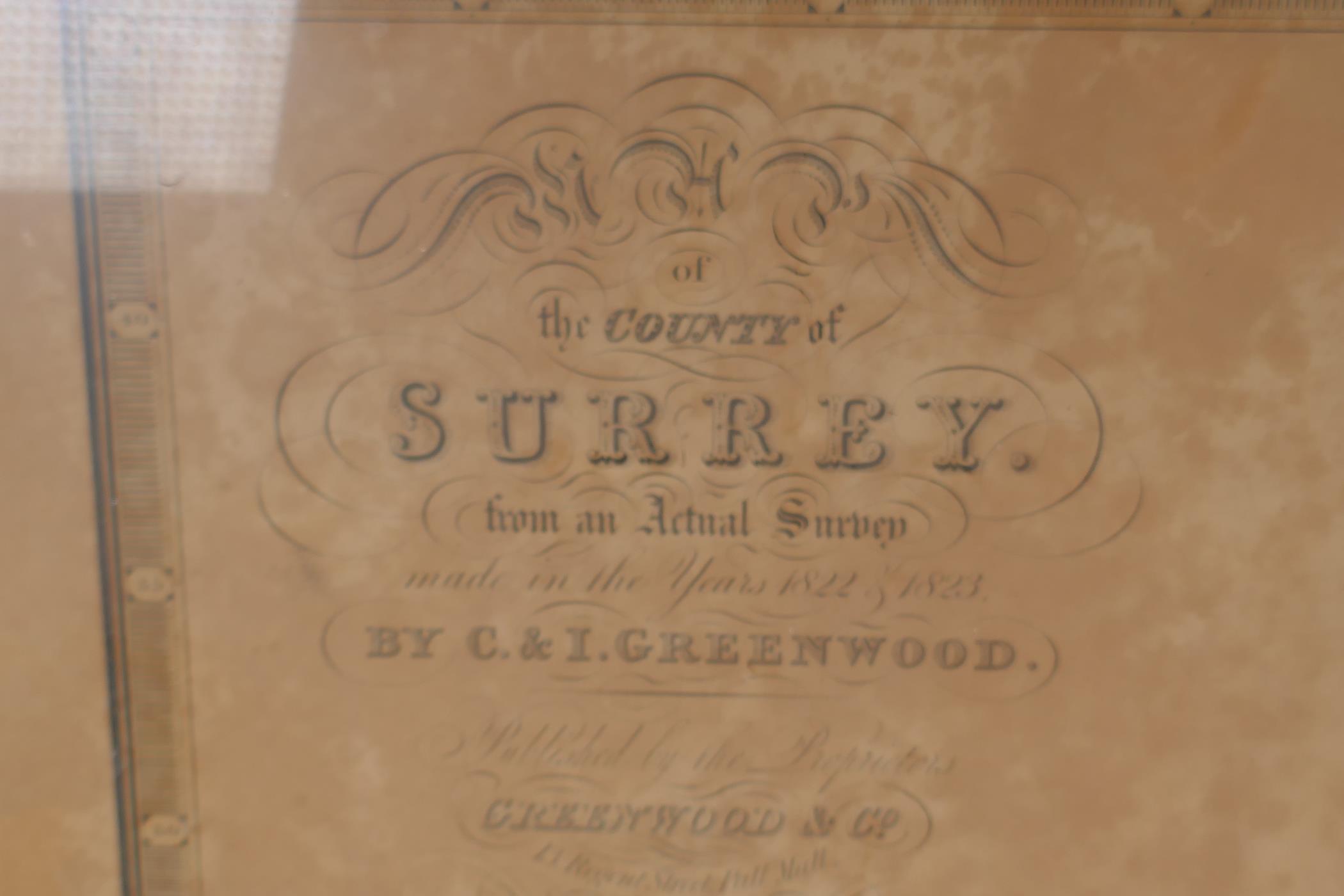 A hand coloured map of Surrey taken from an 1822/3 survey by C. & I. Greenwood, with vignette of - Image 4 of 4
