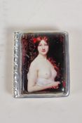 A 925 silver book set with a cold enamel plaque depicting a semi clad woman, 1½" x 1½"