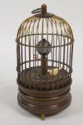 A desk clock in the form of a bird in a cage, 5½" high