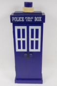A painted wood key cabinet made in the form of a Police Box