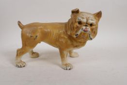 A cold painted cast iron money box in the form of a bulldog, 9" x 6"