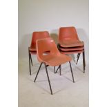 Seventy late C20th plastic stacking chairs with steel frames