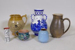 A faience vase with blue and white decoration, 10" high, a studio pottery jug and pot, spill vase,