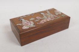 A Chinese rosewood jewellery box with mother of pearl inlaid decoration of women in a garden, 7½"
