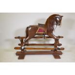 A child's rocking horse on trestle base, recently restored, early / mid C20th, 50" x 42"