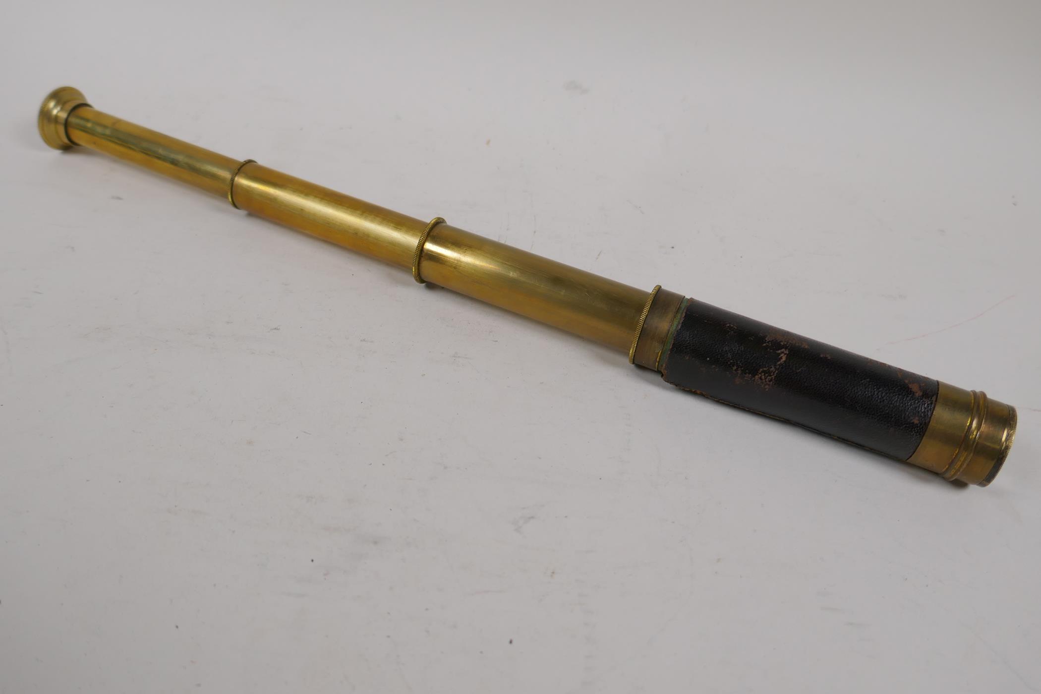 An antique brass three draw pocket telescope, 14" long open - Image 2 of 2