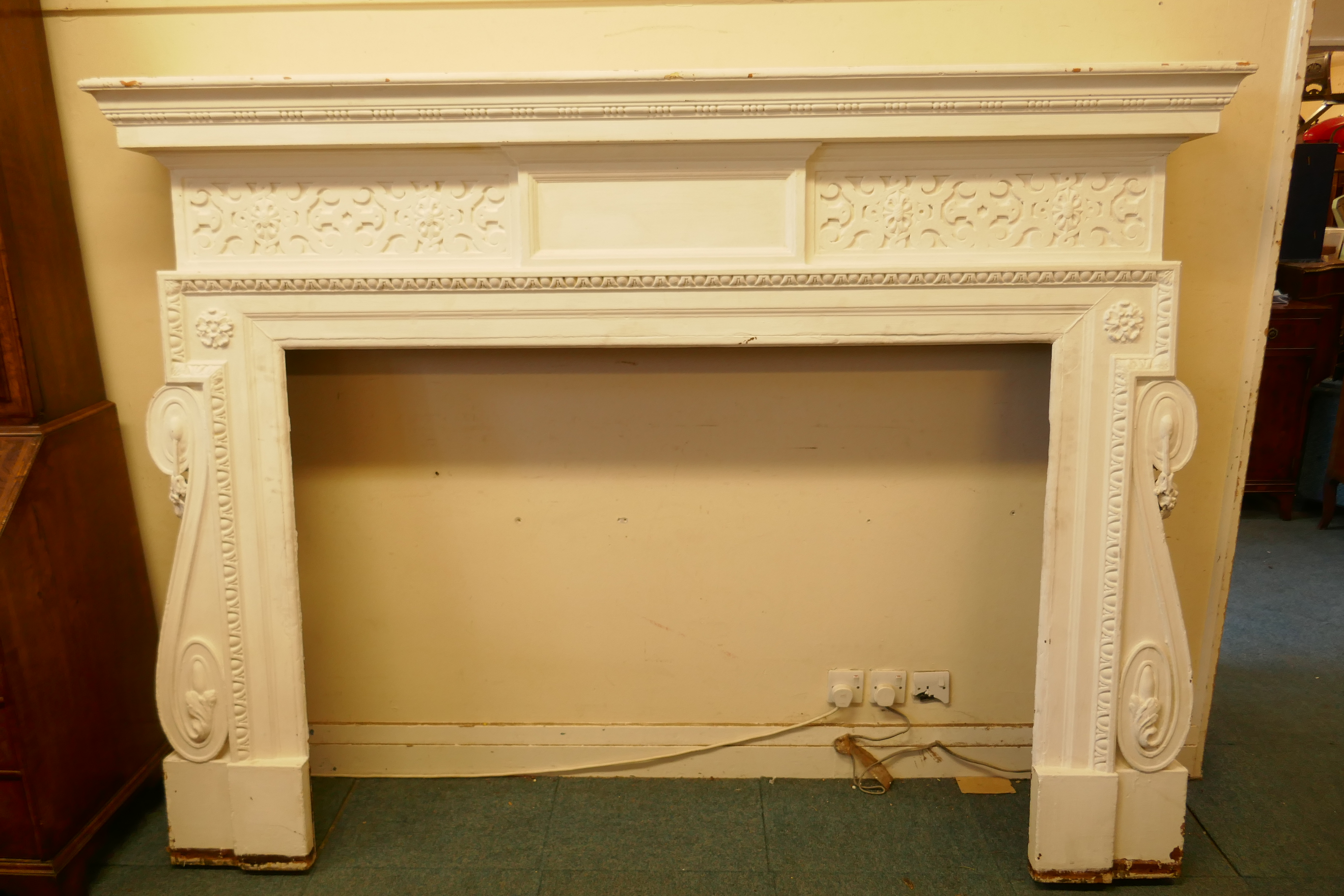 Architectural salvage, a large painted pine fire surround, with carved decoration, late C19th/