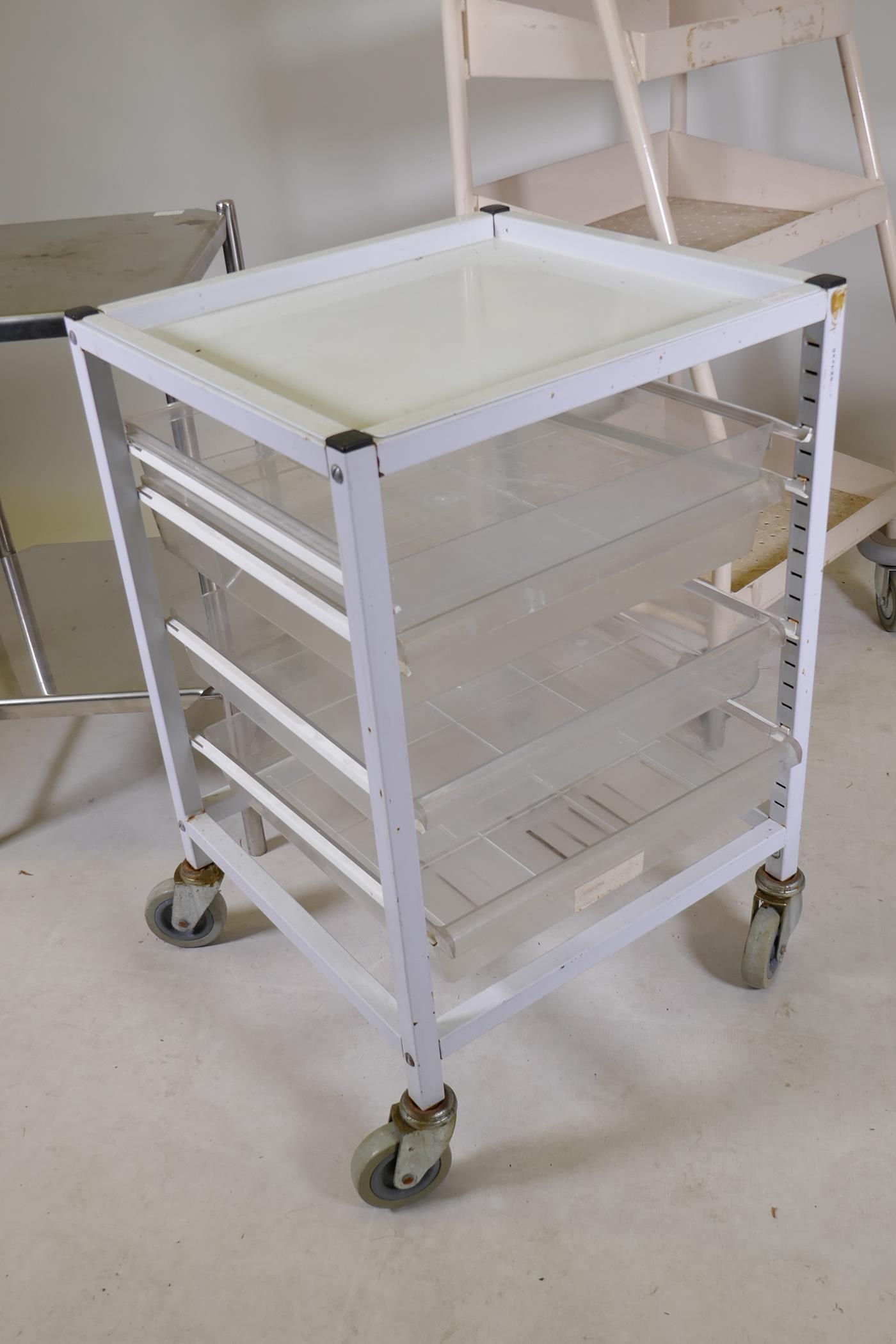 A stainless steel two tier medical instrument table, a fold up instrument table and two medical - Image 4 of 4