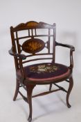 A Victorian inlaid mahogany tub shaped parlour chair