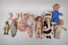 A collection of C19th and C20th dolls and doll parts, including a Simon & Halbig 3½ bisque headed