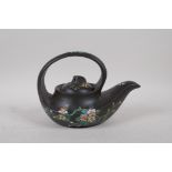 A Chinese earthenware Yixing tea pot with famille rose enamel floral decoration, impressed seal mark