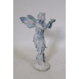 A cast iron garden figure of a fairy holding a bird on her hands, 52cm high