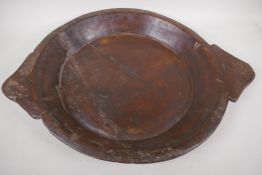 An Indian carved wood bowl/chapati plate, 46cm diameter