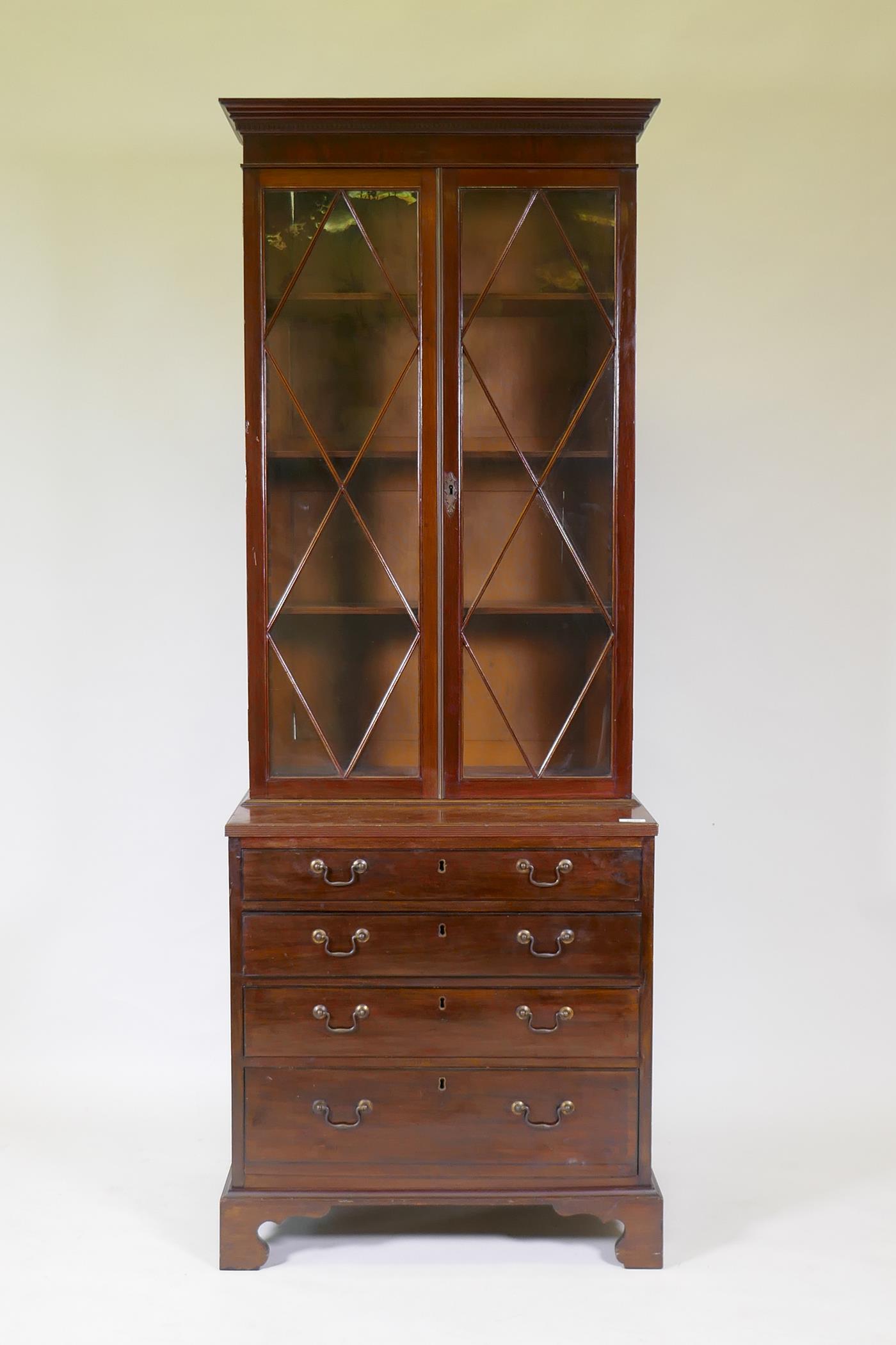 A small C19th mahogany bookcase with glazed top and base with reeded top over four oak lined drawers - Image 2 of 4