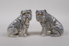 A pair of silver plated salt and pepper condiments in the form of dogs, 6cm high