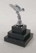 A small Spirit of Ecstasy silver plated paperweight on a stepped plinth, 12cm high overall