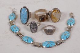 A silver and turquoise enamel bracelet and five silver rings, various sizes