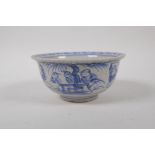 A Chinese blue and white crackle glazed porcelain rice bowl decorated with boys at play, 14cm