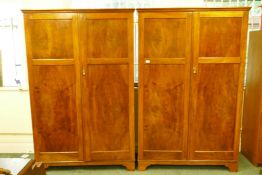 A pair of lady's and gentleman's walnut wardrobes, both with fitted interiors, bearing a label '