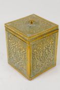 A Chinese embossed brass cased square section tea caddy with metal liner, 10.5cm square