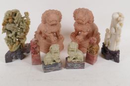 A pair of Chinese carved soapstone Fo dogs, 16cm high, another smaller pair, a pair of kylin