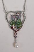 A 925 silver and plique a jour pendant necklace in the form of two cats within a heart, 5cm drop