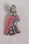 A sterling silver brooch in the form of Jemima Puddleduck with a pink enamel cloak, 4cm