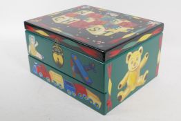 A small painted wood nursery chest the base drawer with music box movement, 30 x 24 x 16cm