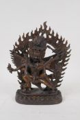 A Sino Tibetan gilt bronze figure depicting the deities Chakrasamvara and Vajravarahi, impressed