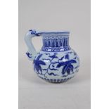 A Chinese blue and white porcelain jug with floral decoration, 4 character mark to side, 14cm high