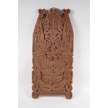 An Indonesian Dayak people hardwood carved panel with figural decoration, 26cm x 56cm