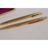 A gilt cased Parker ballpoint pen and bark finish gilt cased Seloafer ballpoint pen