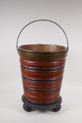 A fruitwood and ebonised brass bound peat bucket with copper liner, 38cm high