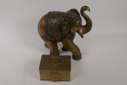 An Indian cast brass figure of an elephant, 26cm high, and an Indian brass spice box