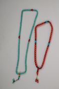 A string of turquoise mala beads and a string of coral mala beads, longest 88cm