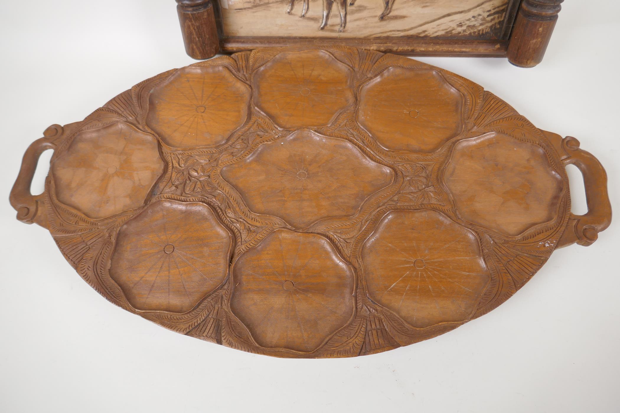 A vintage European carved wooden tray decorated with a naive scene of a man driving a bullock - Image 2 of 4