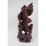 A Chinese root carving of a fisherman with two small boys, 42cm high