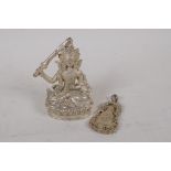 A Chinese white metal figure of a female deity, and a white metal Quan Yin pendant, largest 9cm high