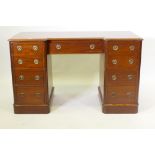 Early C19th mahogany inverted breakfront kneehole desk comprising nine drawers with brass ring