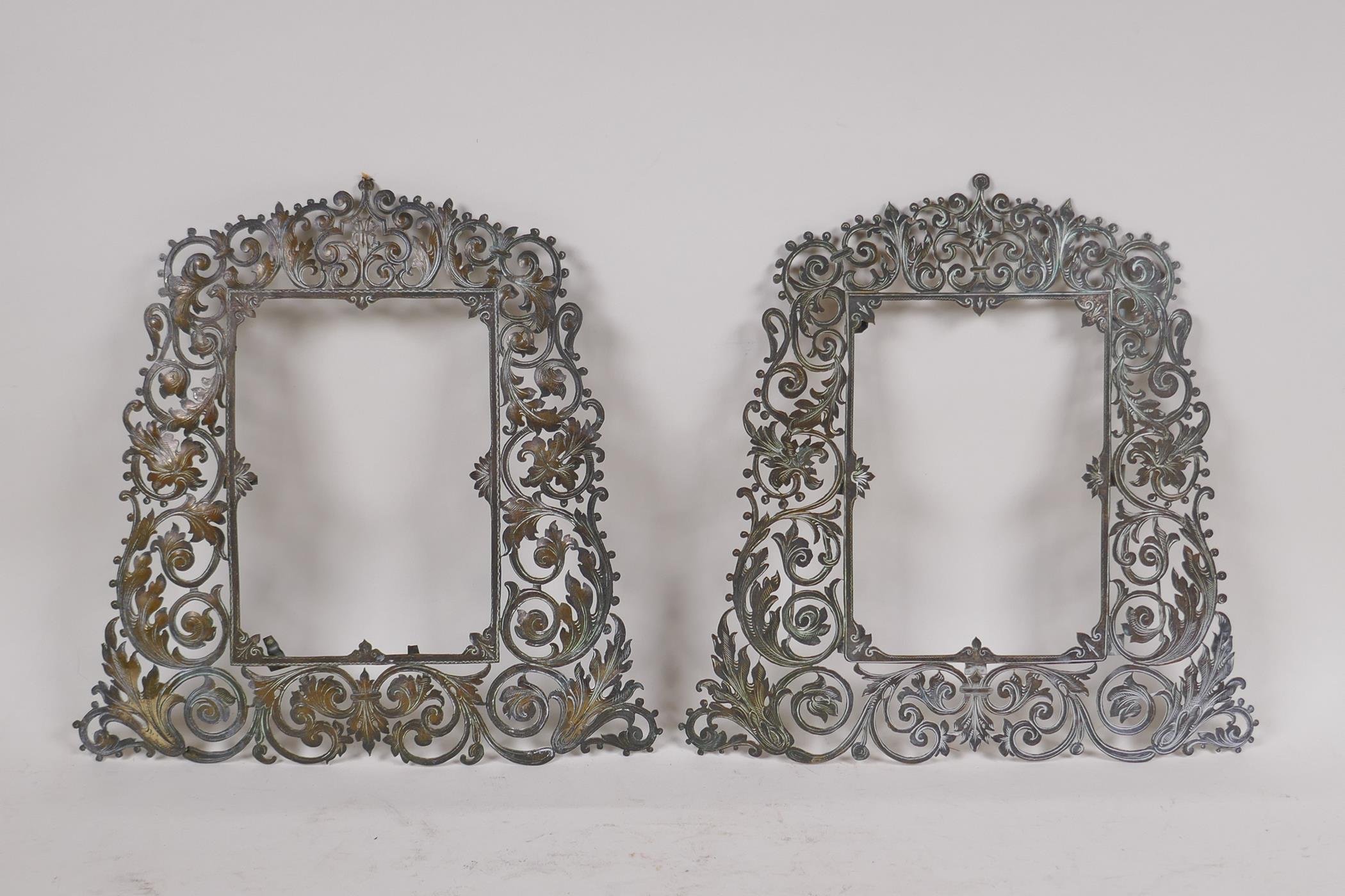 A pair of antique brass frames with pierced scrolling decoration, 23 x 23cm, rebate 10 x 14cm