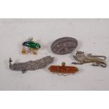 A gilt and enamel frog brooch, and four silver set brooches including goldstone, marcasite etc