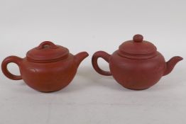 Two Chinese YiXing red earthenware teapots of squat form